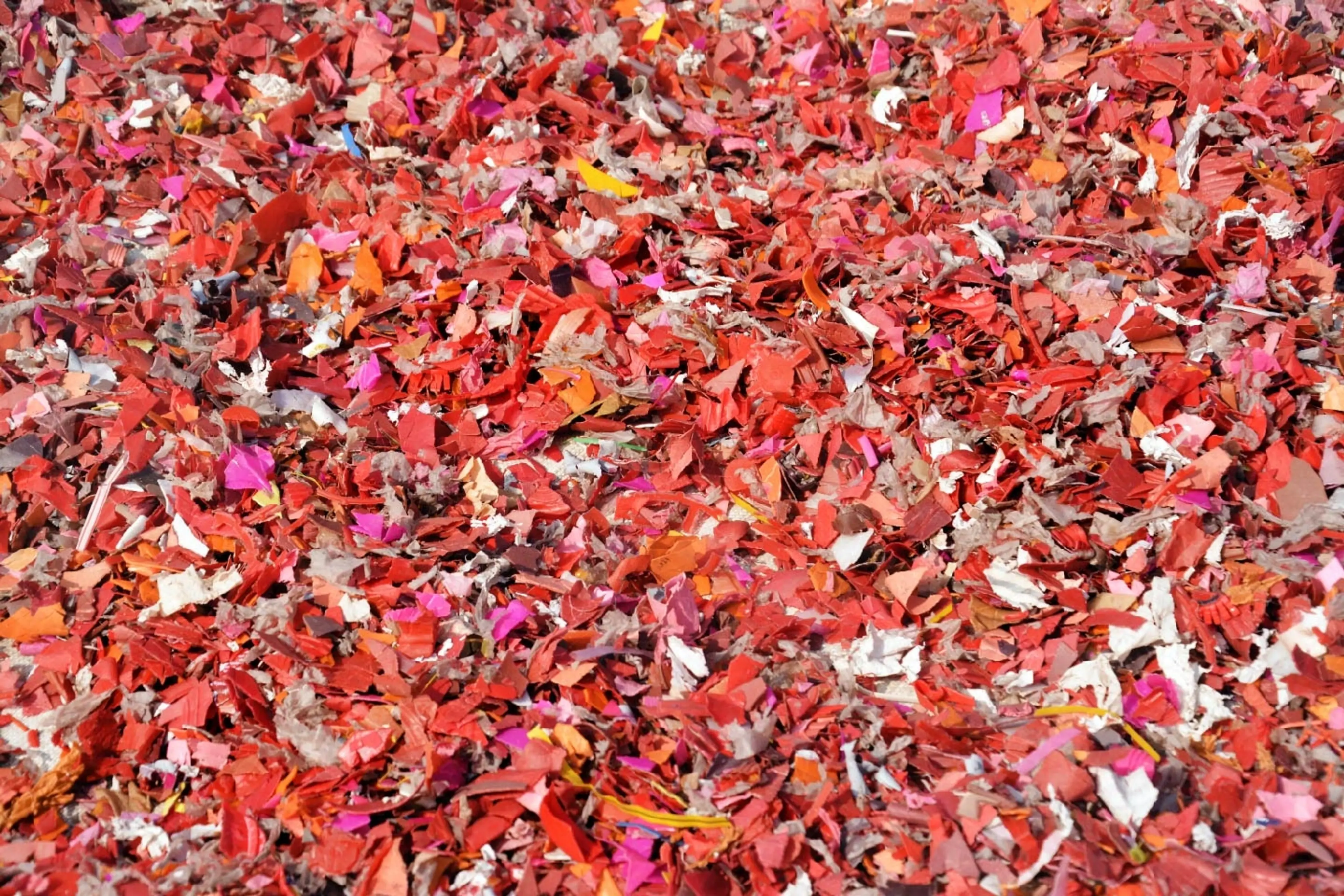 A picture of red shredded plastic