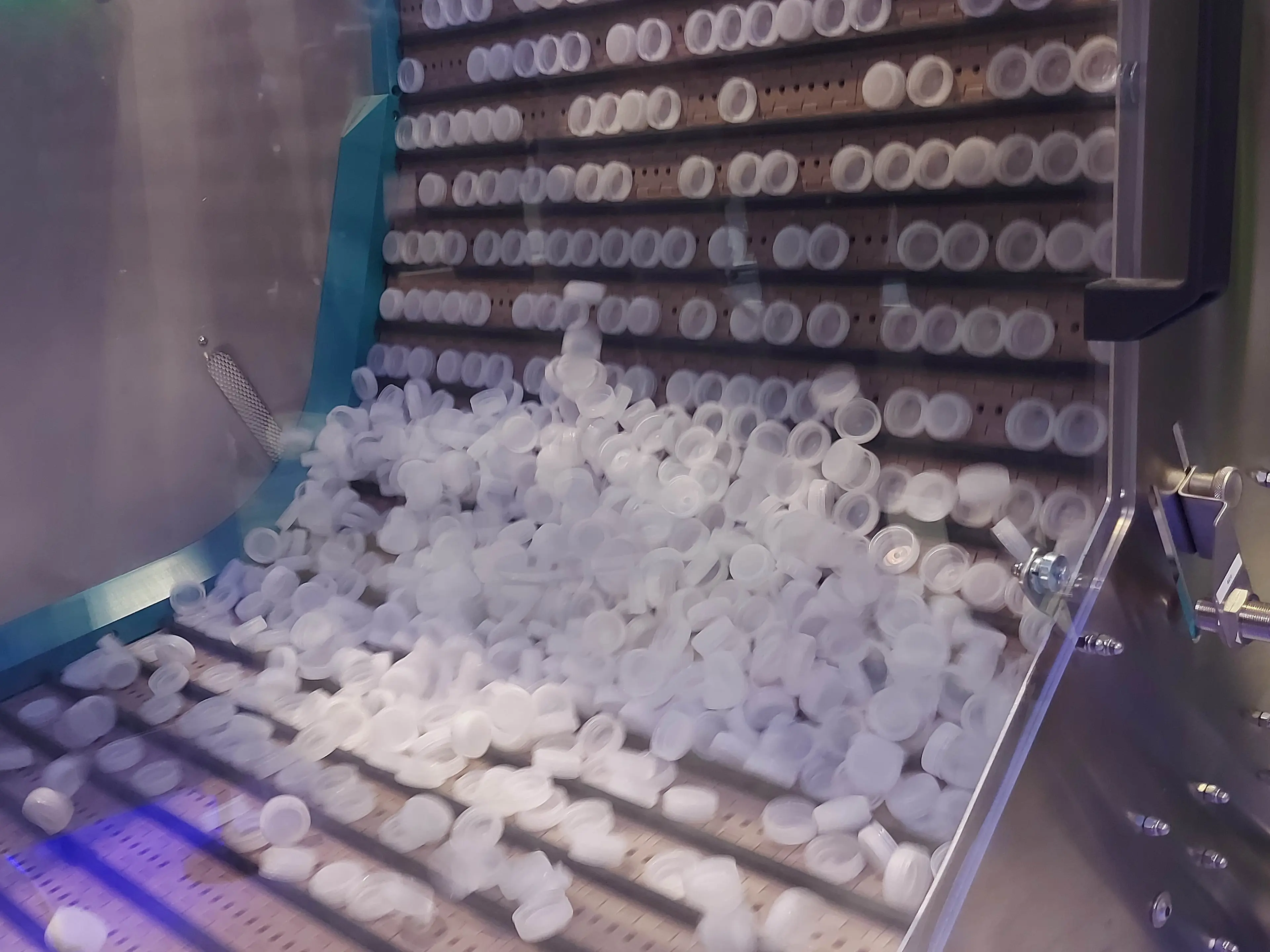 Images of Sumitomo machine making plastics caps and closures